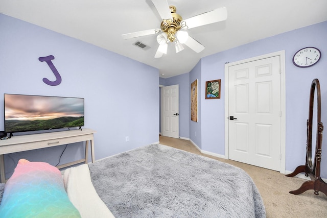 bedroom with visible vents, carpet flooring, baseboards, and ceiling fan