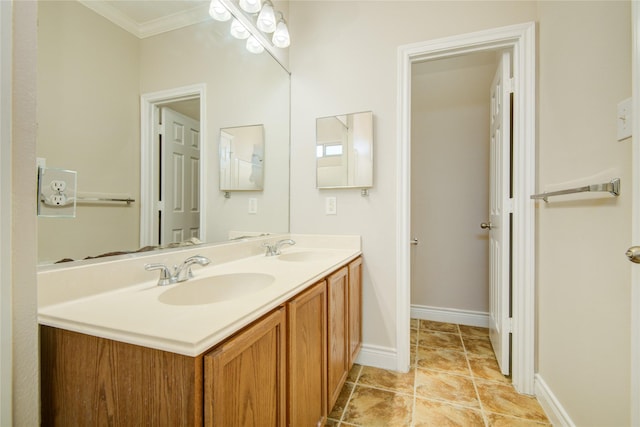 bathroom featuring a sink, baseboards, ornamental molding, and double vanity