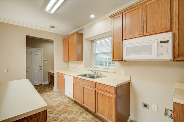 kitchen featuring visible vents, ornamental molding, a sink, white appliances, and light countertops