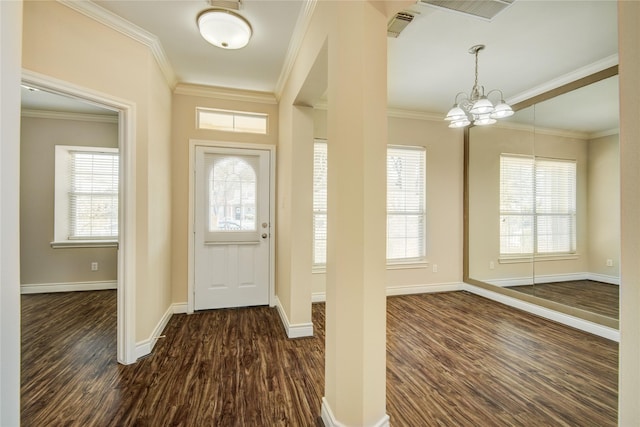 entryway with a wealth of natural light, dark wood-style floors, crown molding, and baseboards