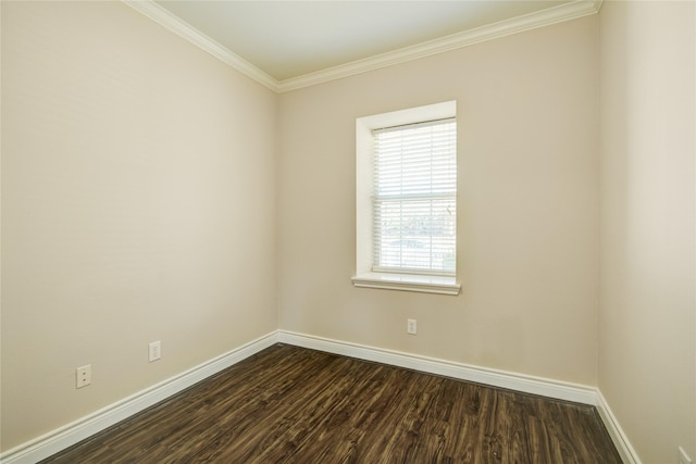 spare room featuring dark wood-style floors, baseboards, and ornamental molding