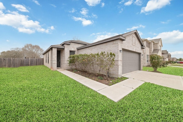 view of front of property featuring brick siding, an attached garage, a front lawn, fence, and driveway