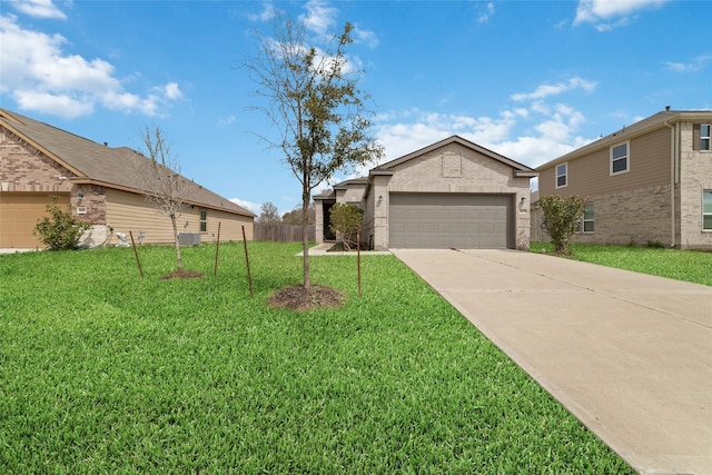 view of front of home featuring fence, driveway, an attached garage, a front lawn, and brick siding