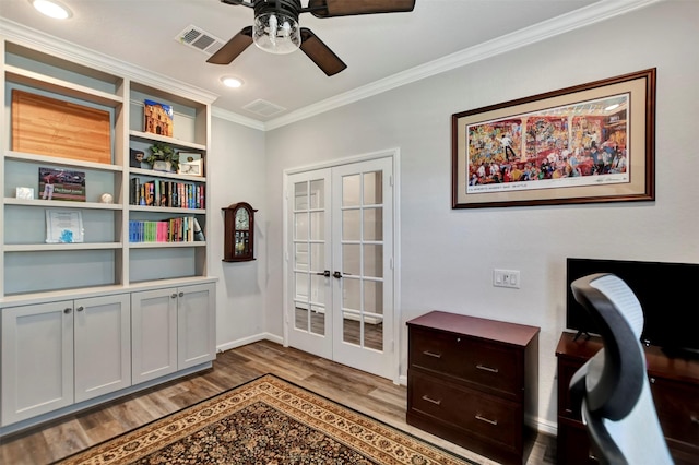 office area with wood finished floors, french doors, visible vents, and ornamental molding