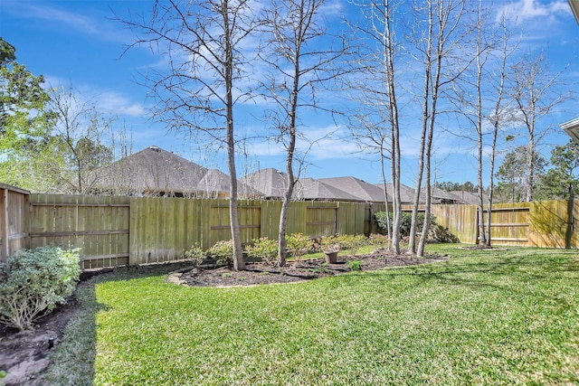 view of yard featuring a fenced backyard