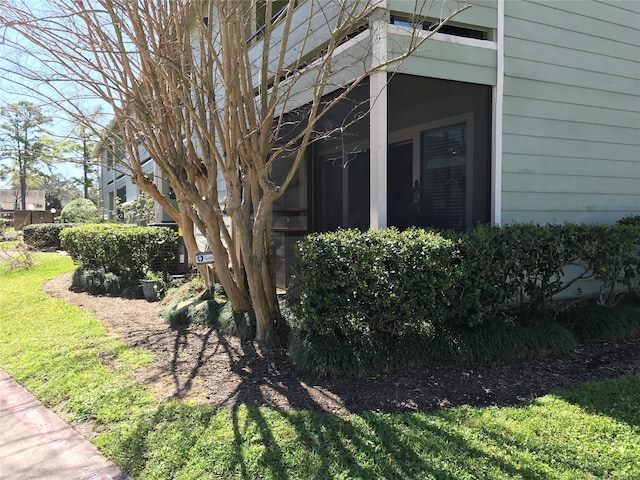 view of home's exterior with a lawn