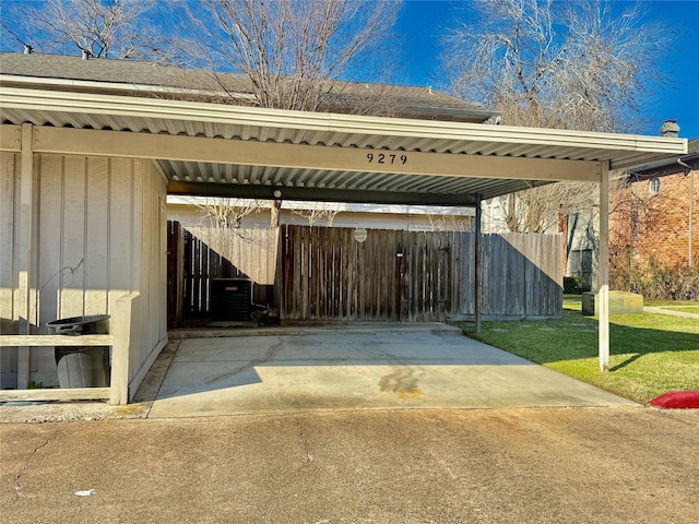 view of parking / parking lot with fence