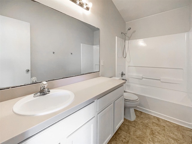 bathroom featuring shower / washtub combination, toilet, and vanity