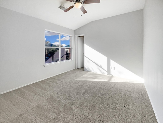 unfurnished room featuring visible vents, baseboards, lofted ceiling, carpet flooring, and a ceiling fan