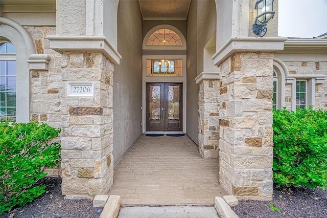 doorway to property with french doors and stone siding