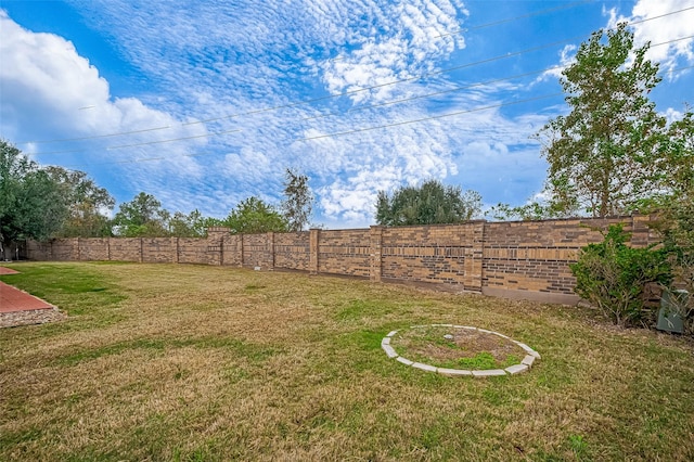 view of yard with a fenced backyard