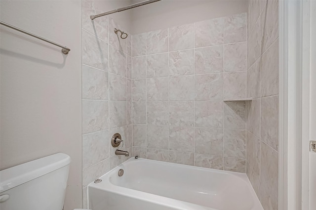 bathroom with toilet and bathtub / shower combination