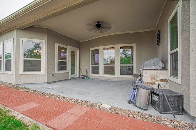 view of patio featuring a ceiling fan