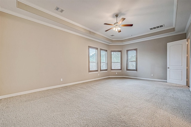 unfurnished room with visible vents, light colored carpet, a ceiling fan, and baseboards