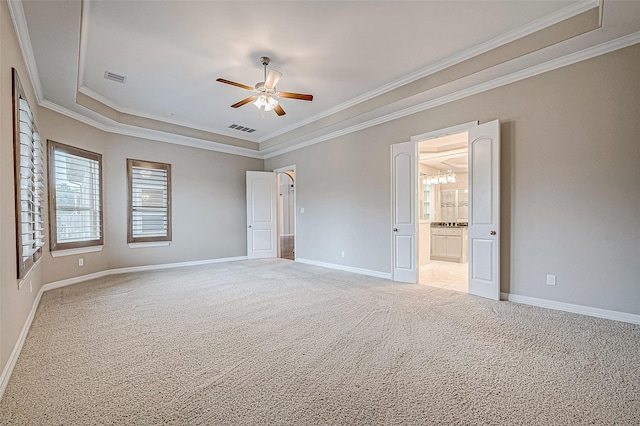 unfurnished bedroom featuring light colored carpet, visible vents, and baseboards