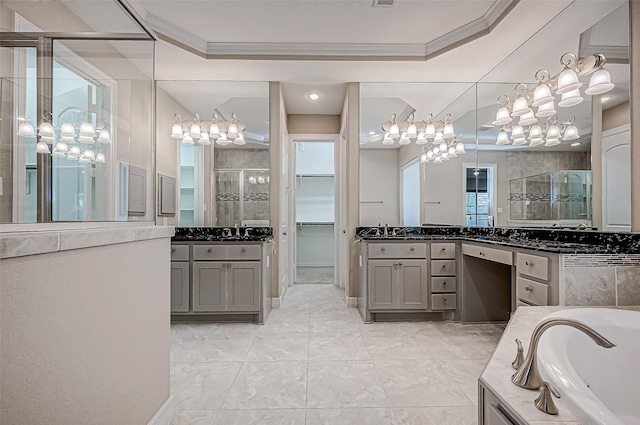 bathroom featuring a tray ceiling, a bath, a stall shower, and ornamental molding