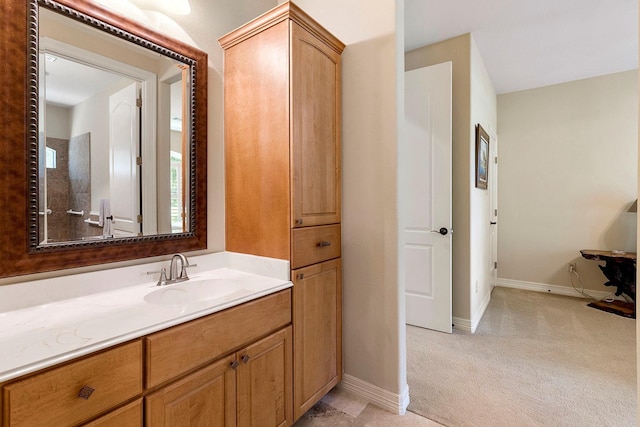 bathroom with baseboards and vanity