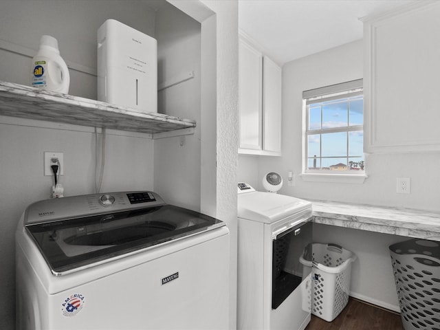 laundry area with laundry area, washer and dryer, and wood finished floors