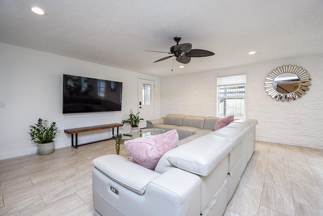 living room featuring a wealth of natural light, baseboards, recessed lighting, and a ceiling fan