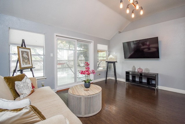 living room with a healthy amount of sunlight, baseboards, lofted ceiling, and wood finished floors