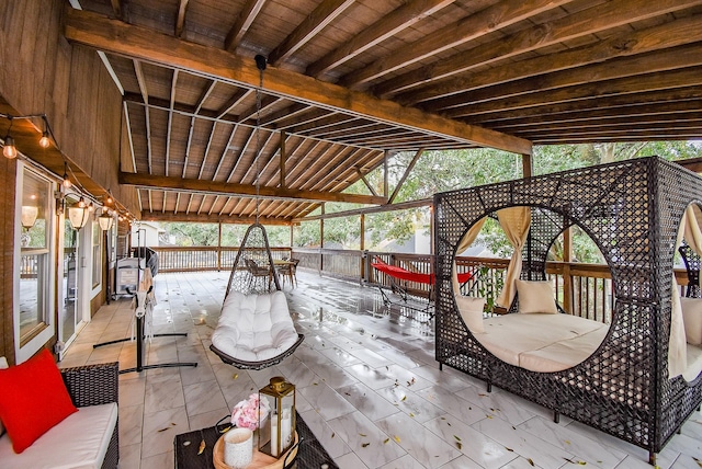 wooden terrace with outdoor dining area