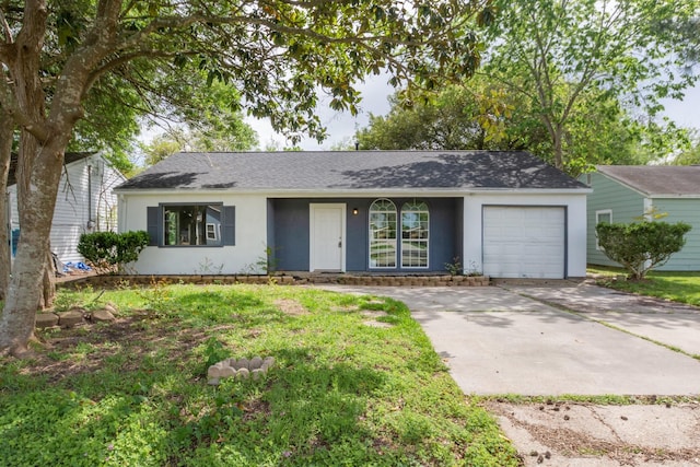 single story home with stucco siding, an attached garage, concrete driveway, and a shingled roof