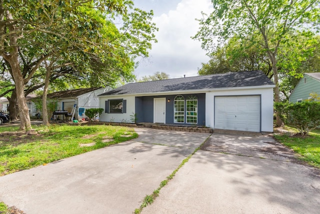 single story home with an attached garage, driveway, and stucco siding