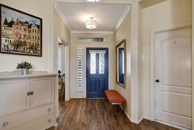 foyer featuring baseboards, ornamental molding, and dark wood finished floors