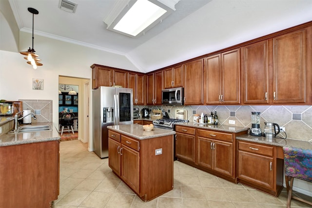 kitchen featuring light stone countertops, visible vents, a sink, stainless steel appliances, and tasteful backsplash