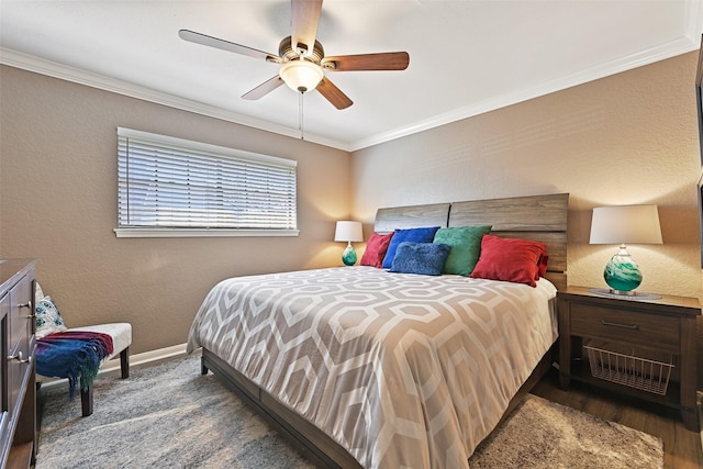 bedroom featuring ceiling fan, a textured wall, baseboards, and ornamental molding