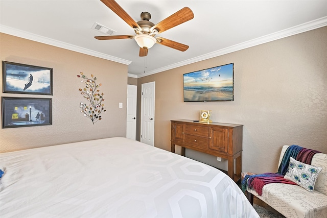 bedroom featuring crown molding, visible vents, and ceiling fan