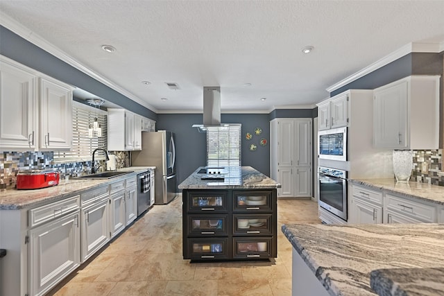 kitchen with a sink, stainless steel appliances, white cabinetry, and island exhaust hood