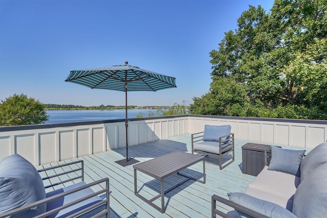 deck with a water view and an outdoor hangout area