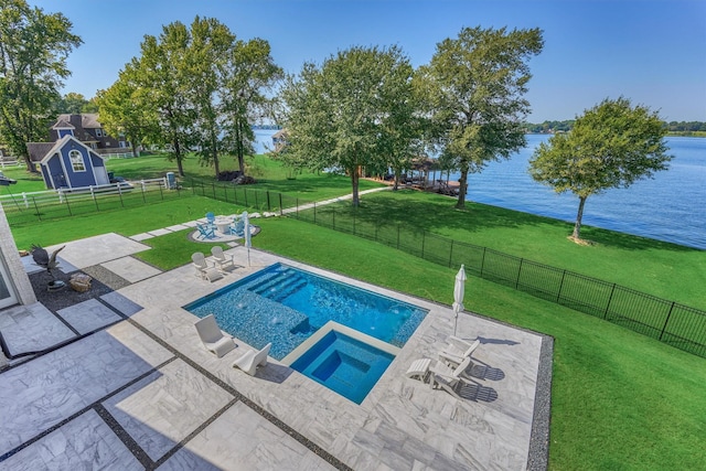 view of pool featuring a yard, a patio area, a water view, and a fenced backyard