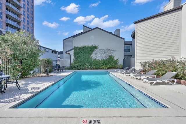 pool with a patio area