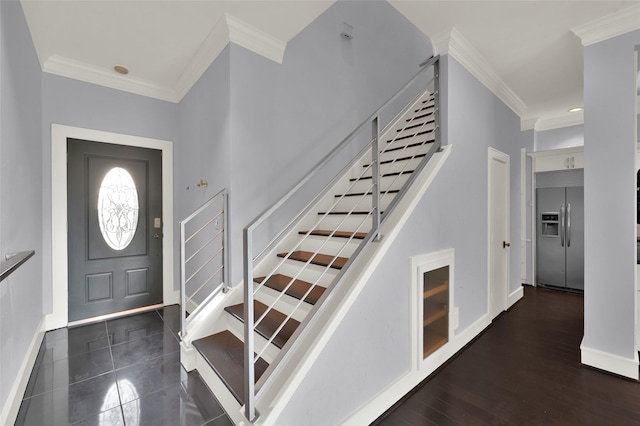 entrance foyer featuring stairway, wood finished floors, baseboards, and ornamental molding