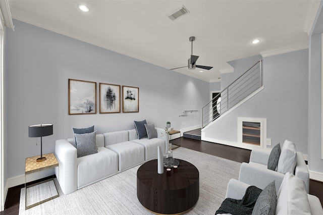 living room featuring recessed lighting, stairway, visible vents, and ornamental molding