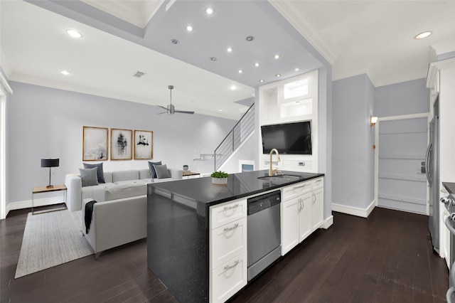 kitchen featuring dark wood-style flooring, ornamental molding, a sink, stainless steel dishwasher, and dark countertops