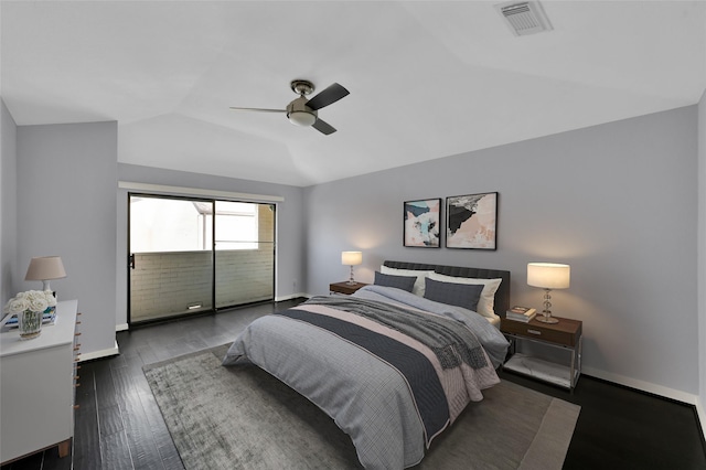 bedroom featuring visible vents, ceiling fan, baseboards, vaulted ceiling, and hardwood / wood-style flooring