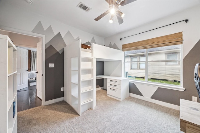 unfurnished bedroom with visible vents, light colored carpet, a ceiling fan, and baseboards