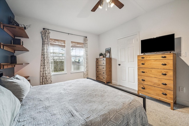 carpeted bedroom with a ceiling fan