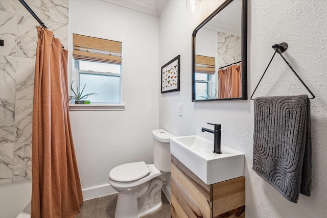 full bath featuring toilet, crown molding, shower / bath combination with curtain, baseboards, and vanity