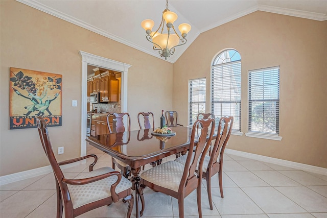 dining area with lofted ceiling, light tile patterned floors, and a wealth of natural light