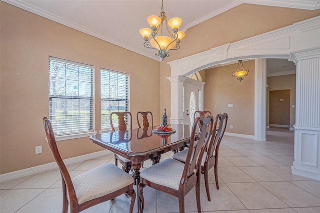 dining room with light tile patterned flooring, arched walkways, and ornamental molding