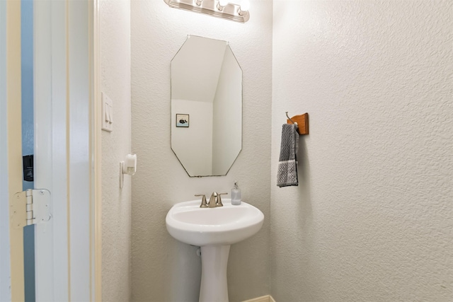 bathroom with a textured wall