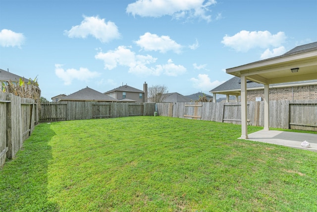 view of yard with a patio area and a fenced backyard