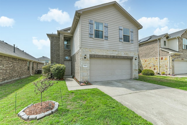 traditional-style house with a front lawn, an attached garage, stone siding, and driveway