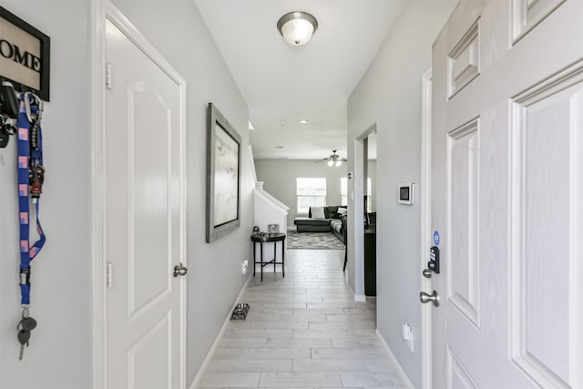 corridor featuring baseboards