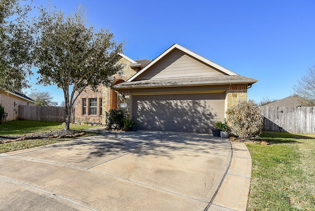 ranch-style home with concrete driveway, a front lawn, and fence