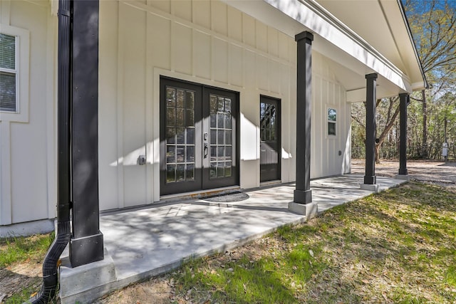 doorway to property with french doors and board and batten siding